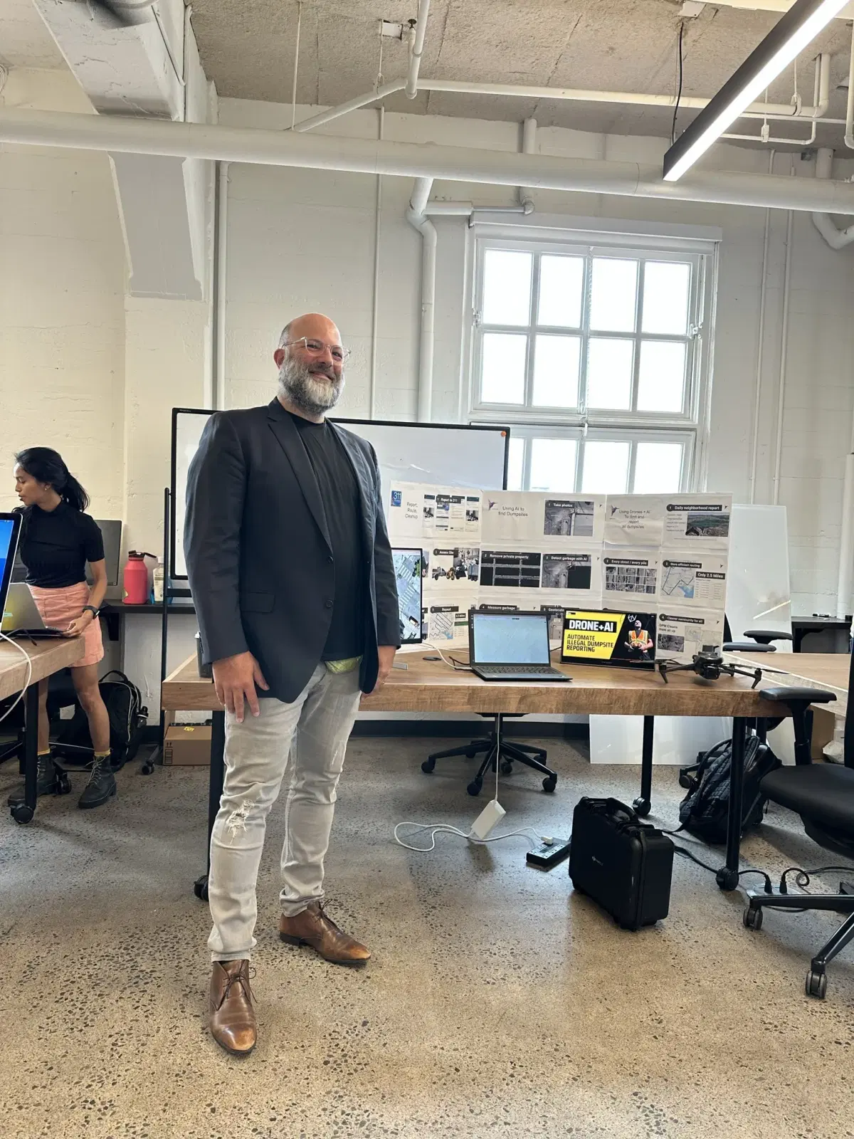 Brian Johnson standing by his Aerbits Exhibit at Generate SF